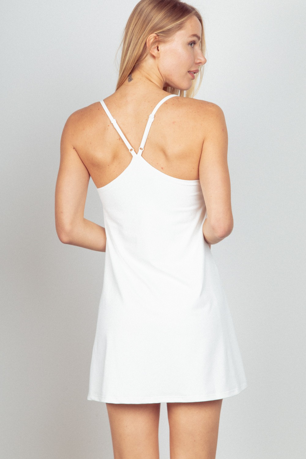 sleeveless tennis dress in white back view