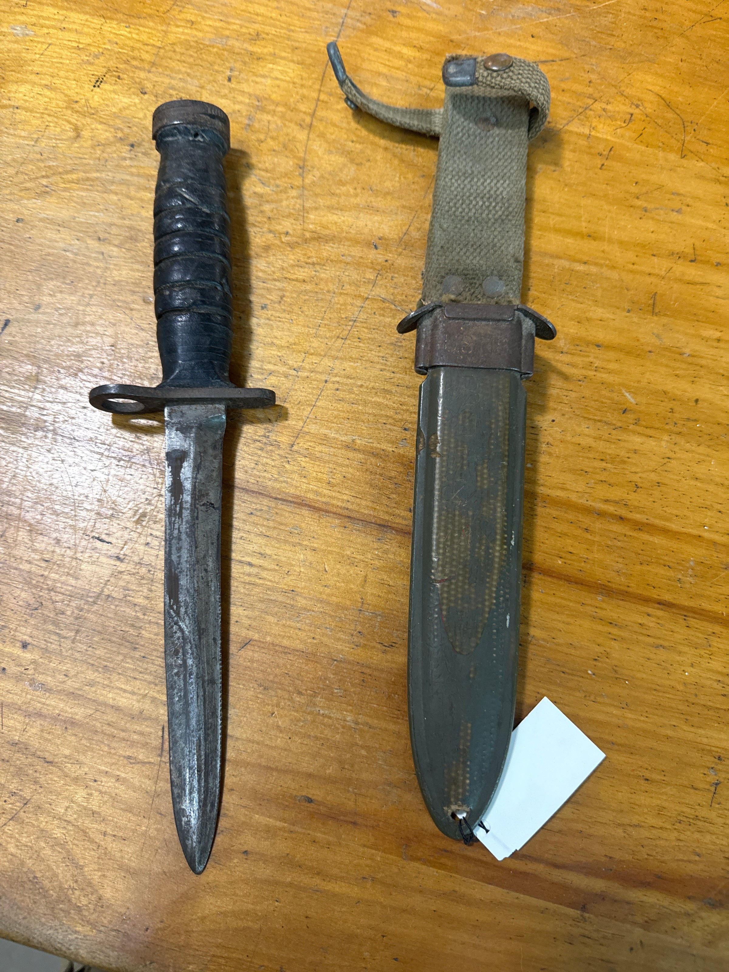 U.S. M4 Bayonet (which has a leather grip and attaches to the M1 Carbine) and its matching U.S. M8 Scabbard