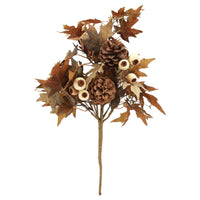 Decorative branch with brown leaves and pine cones on a white background