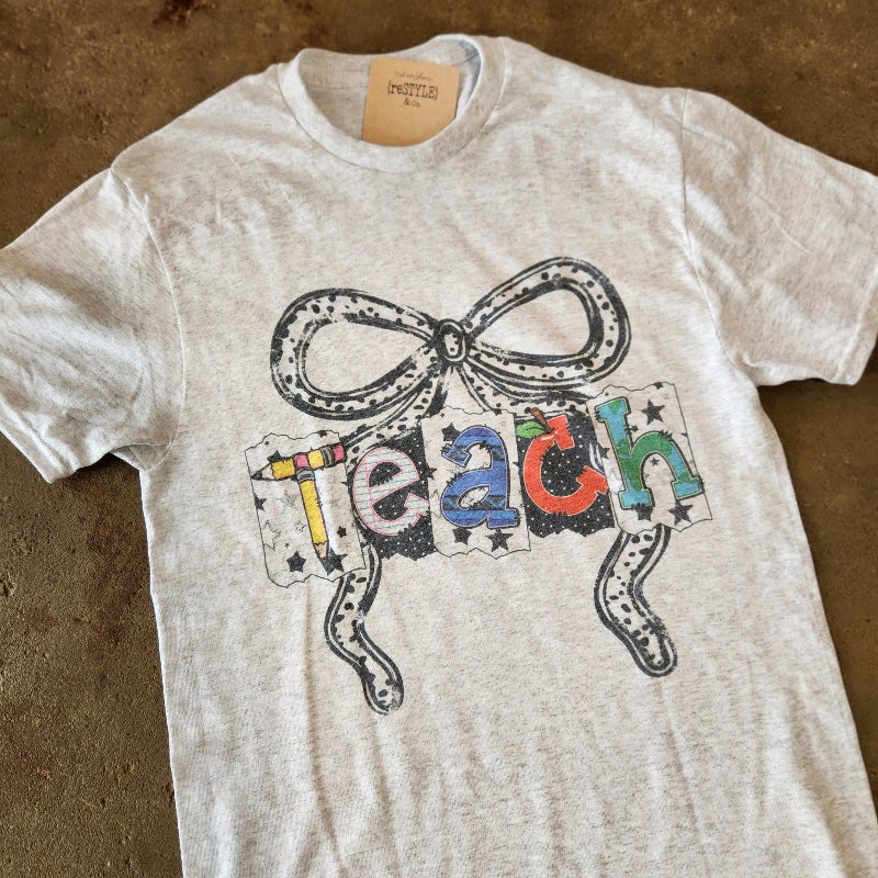 Teach with Bow Graphic Tee
