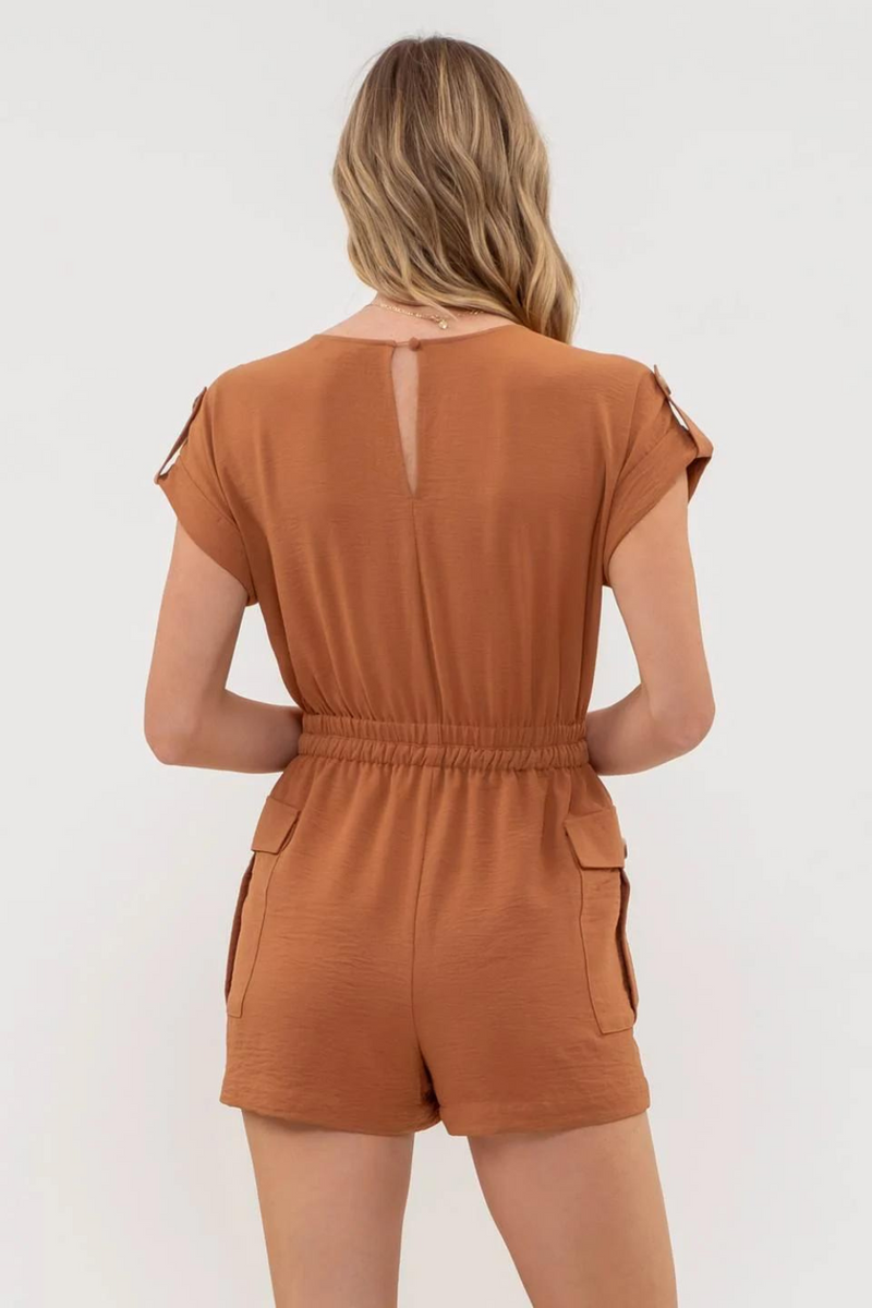 v neck short sleeve romper with cargo pocket in brown back view
