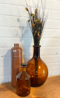 bell-grass-in-amber-vase